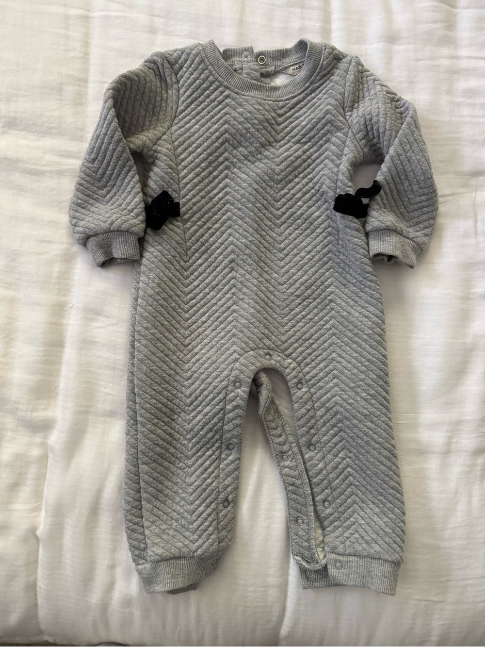 Habitual Gray Quilted Baby One-Piece with Black Bow Accents